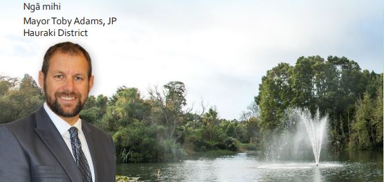 Image of Mayor Toby Adams against a backdrop of the Gilmour Lake and fountain